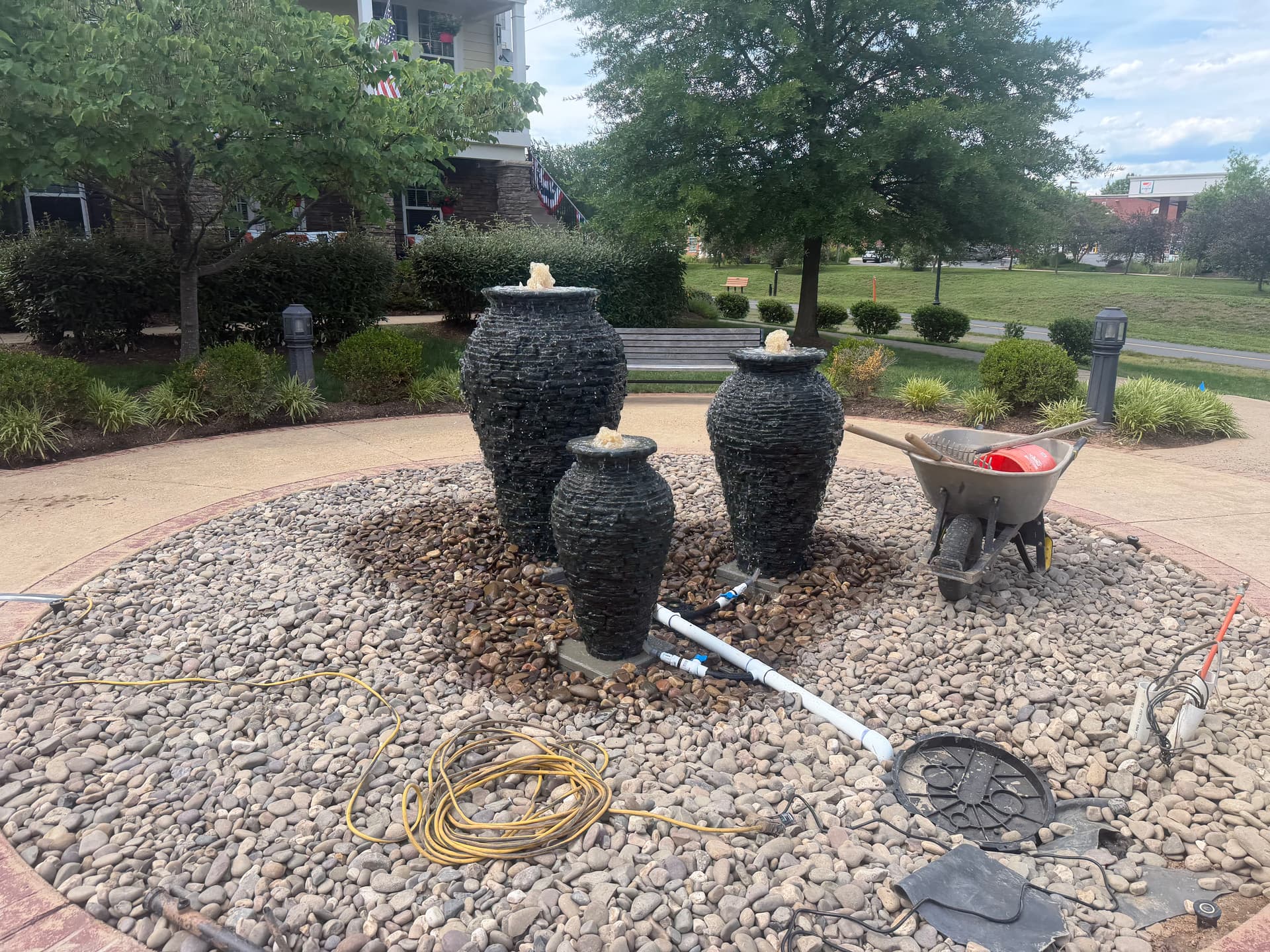 Triple Urn Fountain Installation Putting the Finishing Touches On